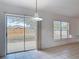 Dining room showcasing the tile floors, sliding glass doors, and natural light at 2818 Irondale St, Deltona, FL 32738