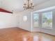 Bright dining room with wood floors, bay windows, and an elegant chandelier at 2818 Irondale St, Deltona, FL 32738