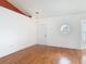 Dining room features a modern light fixture, hardwood floors, and a unique octagon window at 2818 Irondale St, Deltona, FL 32738