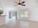 Living room featuring tile flooring and sliding door access to the backyard at 2818 Irondale St, Deltona, FL 32738