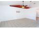 Spacious living room with tile flooring, ceiling fan, and natural light at 2818 Irondale St, Deltona, FL 32738