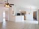 Open living area with tile flooring connected to the kitchen at 2818 Irondale St, Deltona, FL 32738
