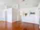Bright living room features hardwood floors, decorative wall cutouts, and architectural details at 2818 Irondale St, Deltona, FL 32738