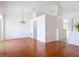 Spacious living room features hardwood floors, decorative wall cutouts, modern lighting, and open spaces at 2818 Irondale St, Deltona, FL 32738