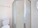 Bathroom featuring a framed glass shower stall with a white toilet at 2818 Irondale St, Deltona, FL 32738