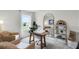 Cozy office with eclectic furniture, natural accents, and ample sunlight, creating a comfortable work environment at 3018 Salisbury Ave, Haines City, FL 33844