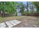 Backyard featuring partial privacy fence, mature trees, and shed at 3204 Amherst Ave, Orlando, FL 32804