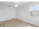 Bedroom boasts hardwood floors and natural light from a large window at 3204 Amherst Ave, Orlando, FL 32804