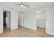 Bedroom with wood-look flooring, closet, and attached bathroom at 3204 Amherst Ave, Orlando, FL 32804