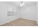 This bedroom features a ceiling fan, natural light, and hardwood floors at 3204 Amherst Ave, Orlando, FL 32804