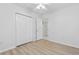 Bedroom features hardwood floors, closet, and an ensuite bathroom at 3204 Amherst Ave, Orlando, FL 32804