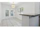 Bright dining area features tile floors, stylish light fixture and double doors at 3204 Amherst Ave, Orlando, FL 32804