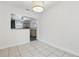 Bright dining area with stylish lighting and a view into the kitchen at 3204 Amherst Ave, Orlando, FL 32804