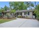 Charming single-story home featuring a well-manicured lawn and a long driveway at 3204 Amherst Ave, Orlando, FL 32804