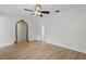 Inviting living room with laminate flooring and an arched doorway to other rooms at 3204 Amherst Ave, Orlando, FL 32804