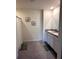 Bright bathroom with dual sinks, a shower-tub combination and tile flooring at 321 Jovana Rd, Davenport, FL 33837