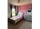 bedroom featuring colorful decor, a large window, and a cozy atmosphere at 321 Jovana Rd, Davenport, FL 33837