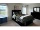 Comfortable bedroom features a large window, blackout curtains, and a queen-sized bed at 321 Jovana Rd, Davenport, FL 33837
