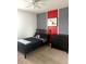 Cozy bedroom with a contemporary design, sleek furniture, and natural light at 321 Jovana Rd, Davenport, FL 33837