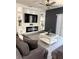 Inviting living room features a modern fireplace, stylish decor and a ceiling fan at 321 Jovana Rd, Davenport, FL 33837