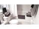 Cozy bathroom featuring a shower-tub combo, decorative towels, and window with blinds at 416 Calabria Ave, Davenport, FL 33897