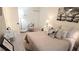 Comfortable bedroom with a plush bed, stylish decor, and ample natural light, creating a serene retreat at 416 Calabria Ave, Davenport, FL 33897