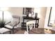 Close up on cozy dining area with table decor, a chair, and a display stand in the corner of a living space at 416 Calabria Ave, Davenport, FL 33897
