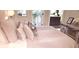 Bright main bedroom with a comfortable bed, access to balcony, stylish decor, and plenty of natural light at 416 Calabria Ave, Davenport, FL 33897