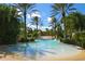Inviting pool surrounded by lush landscaping, palm trees, and comfortable lounge chairs at 416 Calabria Ave, Davenport, FL 33897