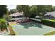 A private basketball court is surrounded by manicured landscaping, a play set, and a fenced-in yard at 4411 Little Water St, Orlando, FL 32817