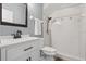 Bathroom features a white vanity with sleek black hardware and a walk in shower at 4411 Little Water St, Orlando, FL 32817