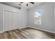 Bright bedroom featuring hard wood floors, a ceiling fan and natural light at 4411 Little Water St, Orlando, FL 32817
