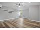 Spacious room featuring hard wood floors, a ceiling fan, and a window with natural light at 4411 Little Water St, Orlando, FL 32817