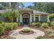 Inviting home exterior with well-kept landscaping, a circular walkway, and a grand entrance at 4411 Little Water St, Orlando, FL 32817