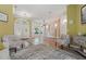 Elegant living room with new flooring, chair rail molding, and ample natural light from the front windows at 4411 Little Water St, Orlando, FL 32817