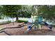 The community playground is surrounded by swings, a picnic table, and a slide in this inviting space at 4411 Little Water St, Orlando, FL 32817
