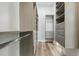 Large custom walk-in closet offers ample storage with shelving and drawers at 4411 Little Water St, Orlando, FL 32817