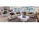 Comfortable living area with a sofa, modern coffee table, and open layout to the kitchen at 4582 Boxwood Way, Mount Dora, FL 32757