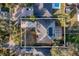 Aerial view of a home with solar panels, screened-in pool, and a well-manicured backyard at 4837 Lorraine Way, Orlando, FL 32812