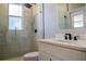 Bright, modern bathroom featuring a glass-enclosed shower and sleek vanity at 4837 Lorraine Way, Orlando, FL 32812