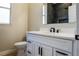 Contemporary bathroom with black fixtures, a marble countertop, and modern toilet at 4837 Lorraine Way, Orlando, FL 32812