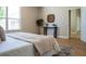 Bright bedroom features wood floors and a decorative accent table with stylish basket wall decor at 4837 Lorraine Way, Orlando, FL 32812