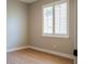 Bright bedroom with white plantation shutters and modern laminate flooring at 4837 Lorraine Way, Orlando, FL 32812