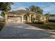 Long driveway leading to a well maintained single-story home with a 2-car garage at 4837 Lorraine Way, Orlando, FL 32812