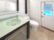 Contemporary bathroom with an unique glass countertop sink and modern shelves at 4993 Heatherstone Pl, Orlando, FL 32812