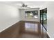Bright bedroom with modern flooring, a sliding glass door, and a ceiling fan at 4993 Heatherstone Pl, Orlando, FL 32812
