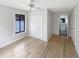 A bright and airy bedroom with hardwood floors, closet space, and backyard view at 4993 Heatherstone Pl, Orlando, FL 32812
