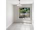 Bright breakfast nook with a large window offers tranquil views of the fenced yard at 4993 Heatherstone Pl, Orlando, FL 32812