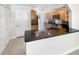Bright kitchen featuring granite countertops, stainless steel appliances, and tile flooring at 4993 Heatherstone Pl, Orlando, FL 32812