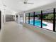 Expansive patio offers clear views of the sparkling pool, great for relaxing and entertaining at 4993 Heatherstone Pl, Orlando, FL 32812
